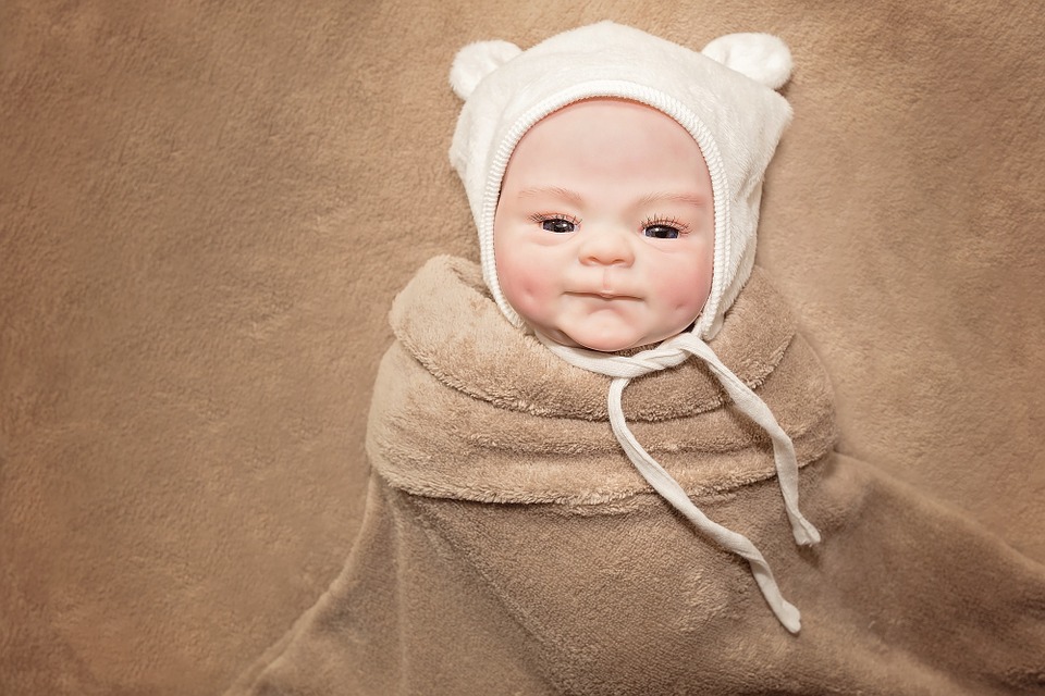 cute baby body wrapped and hat