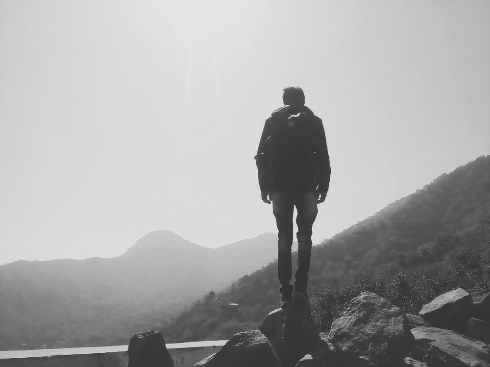 man with backpack doing hiking