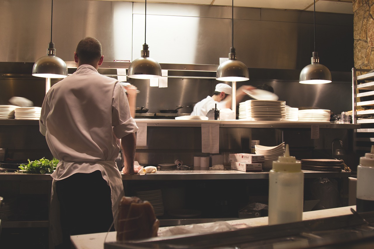 men working inside a kitchen
